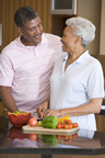 elderly couple preparing vegetables in the kitchen